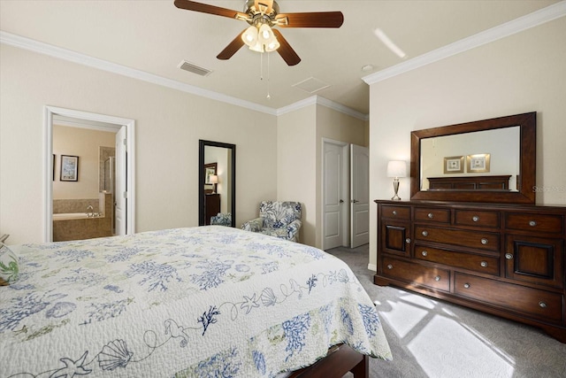 bedroom featuring ensuite bathroom, carpet flooring, ornamental molding, and ceiling fan