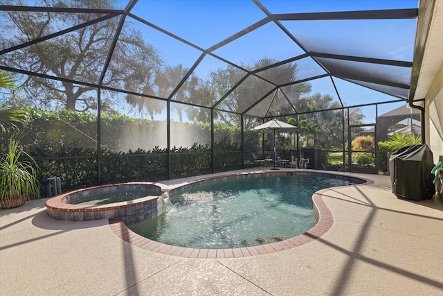 view of pool featuring a patio, a lanai, and an in ground hot tub