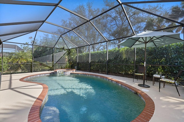 view of swimming pool featuring an in ground hot tub, a patio area, and glass enclosure