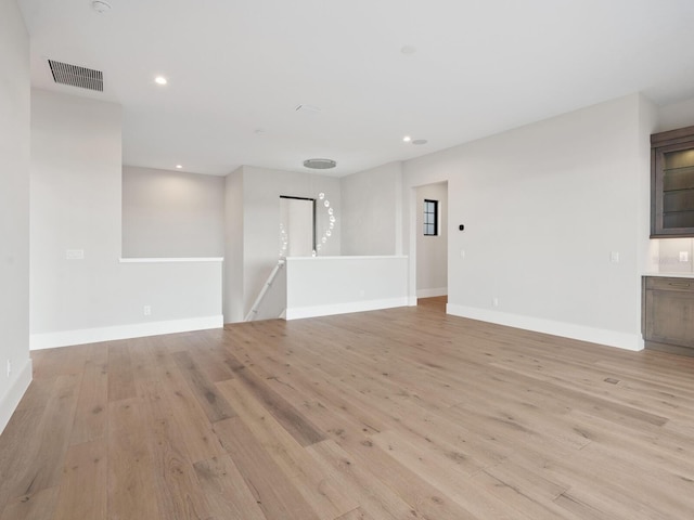 unfurnished living room featuring light hardwood / wood-style floors