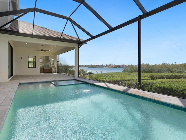 view of swimming pool with a water view, glass enclosure, ceiling fan, and a patio area