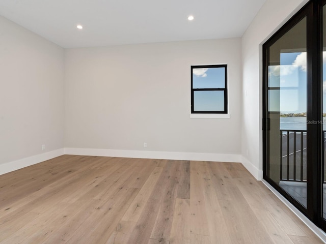 unfurnished room featuring light hardwood / wood-style flooring