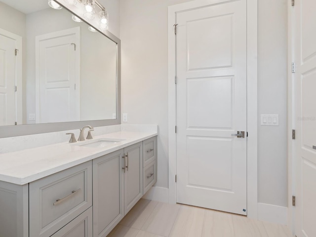 bathroom featuring tile patterned floors and vanity