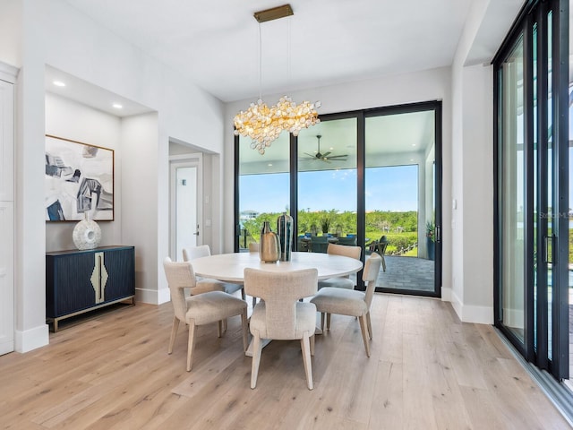 1109 Bayshore Rd, Nokomis, FL 34275 - dining area featuring light wood-style flooring, baseboards, a chandelier, and recessed lighting