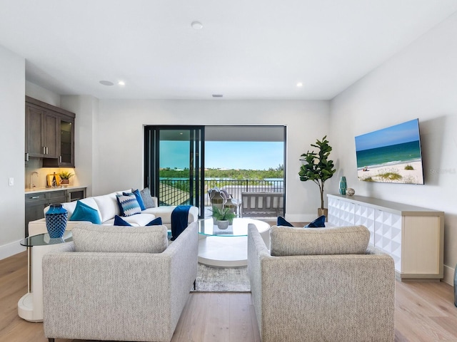 1109 Bayshore Rd, Nokomis, FL 34275 - living area featuring light wood-style floors, recessed lighting, and baseboards