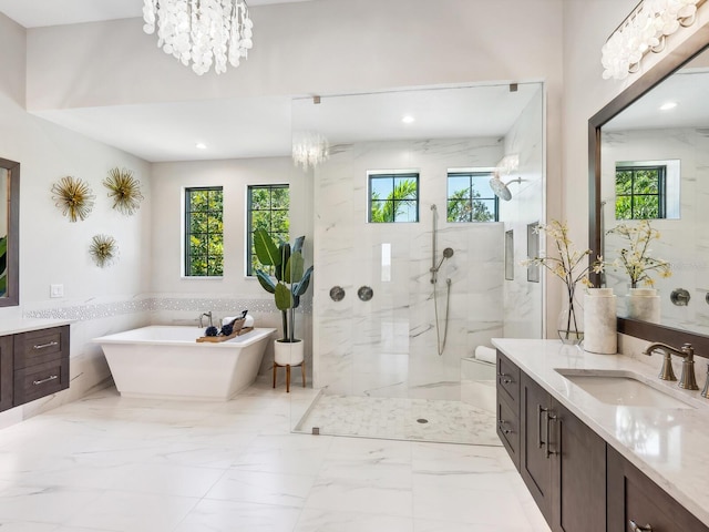 1109 Bayshore Rd, Nokomis, FL 34275 - bathroom featuring vanity, a soaking tub, a marble finish shower, marble finish flooring, and recessed lighting