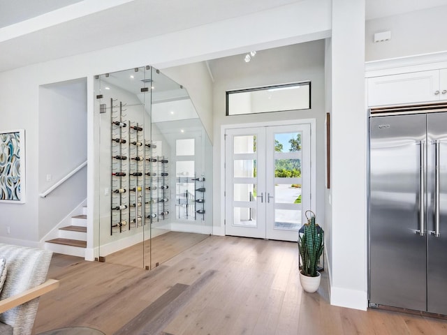 1109 Bayshore Rd, Nokomis, FL 34275 - wine area featuring baseboards, light wood finished floors, and french doors