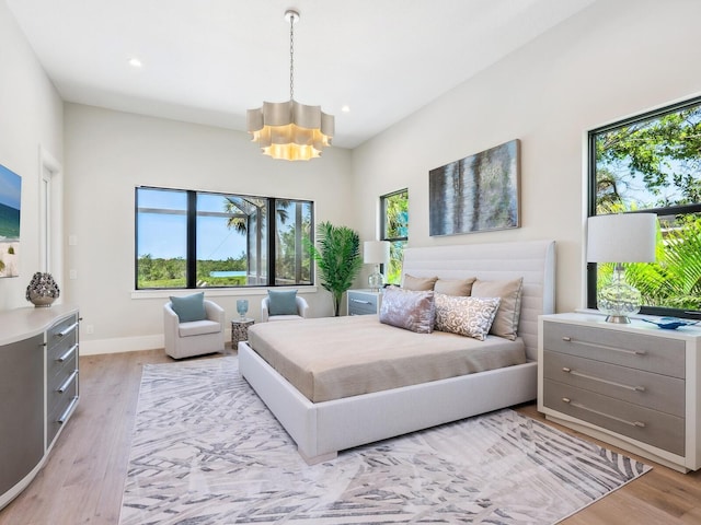 1109 Bayshore Rd, Nokomis, FL 34275 - bedroom featuring a chandelier, light wood finished floors, recessed lighting, and baseboards