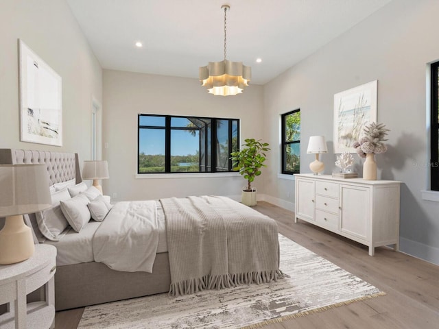 1109 Bayshore Rd, Nokomis, FL 34275 - bedroom featuring light wood-style flooring, a chandelier, recessed lighting, and baseboards