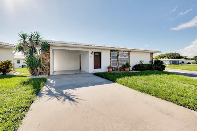 single story home featuring a front yard