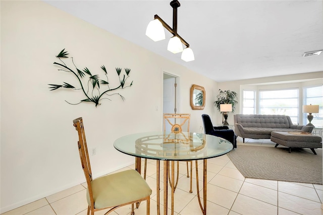 dining area with light tile patterned flooring