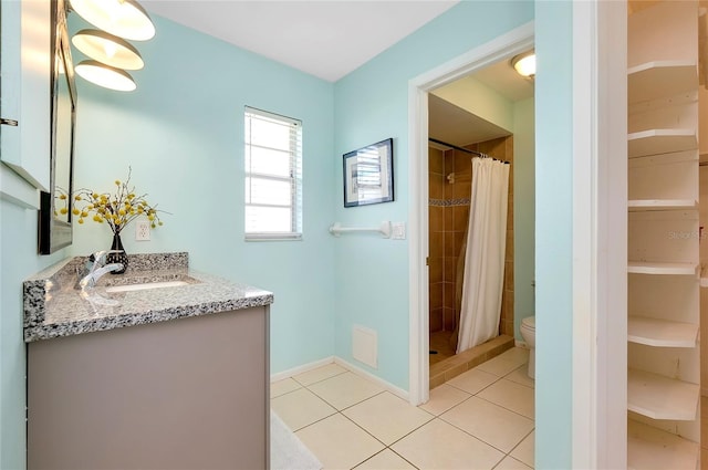 bathroom with toilet, tile patterned flooring, a shower with curtain, and vanity