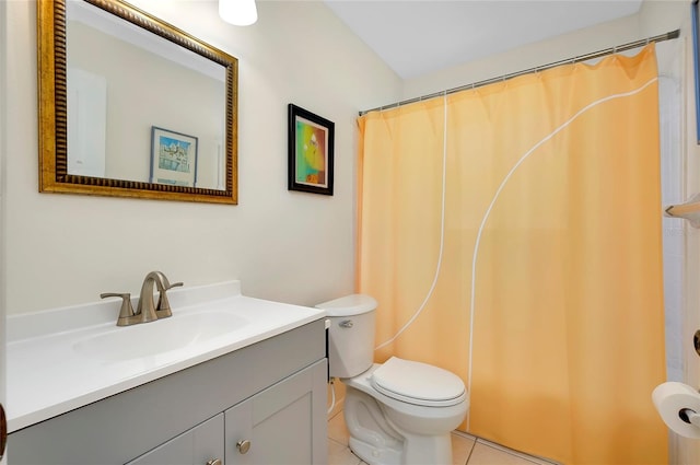 bathroom with toilet, tile patterned flooring, walk in shower, and vanity