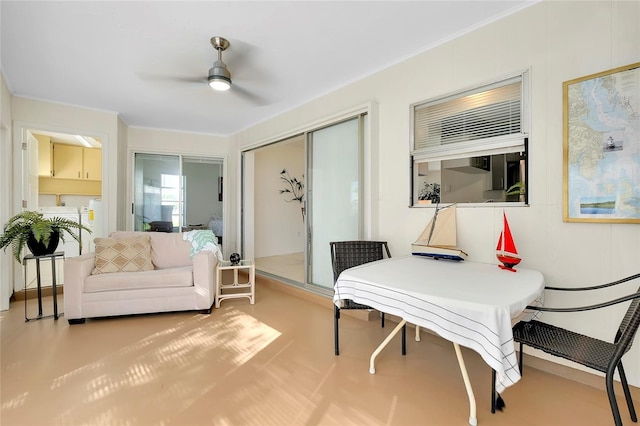 interior space with ceiling fan and crown molding