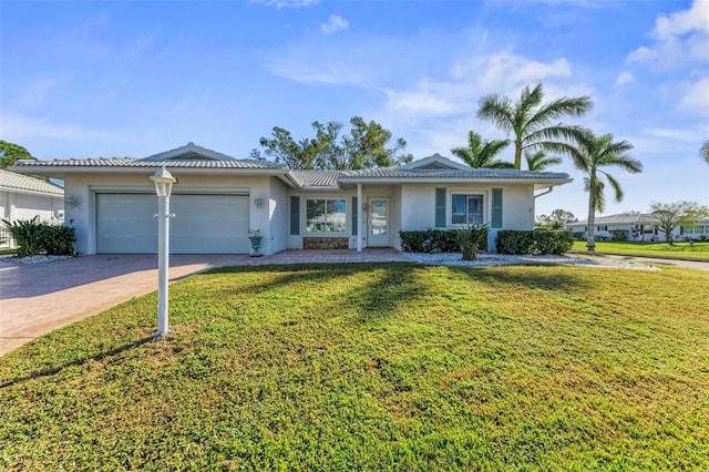 ranch-style home with a front lawn and a garage