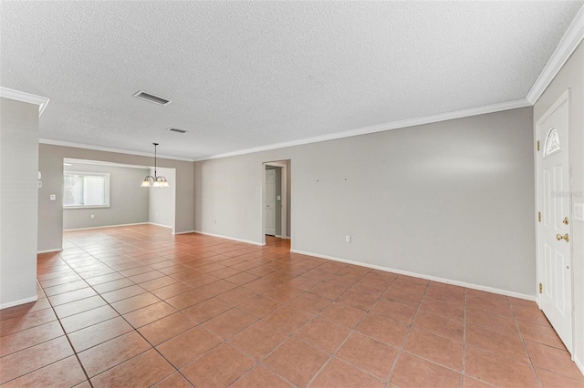 empty room featuring an inviting chandelier, crown molding, a textured ceiling, and light tile patterned floors