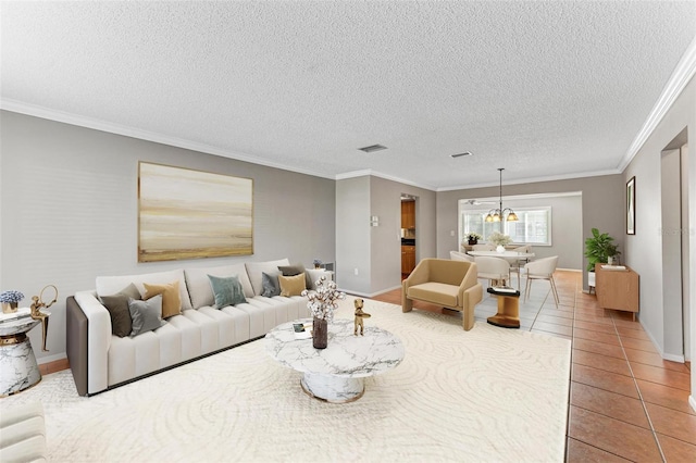 tiled living room with crown molding and a textured ceiling