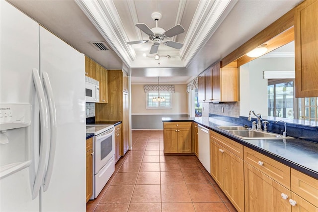 kitchen featuring kitchen peninsula, tasteful backsplash, a raised ceiling, sink, and white appliances