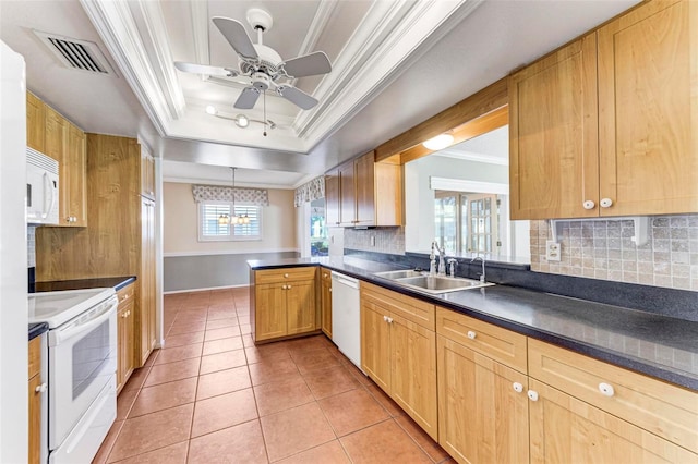 kitchen featuring white appliances, backsplash, sink, and kitchen peninsula