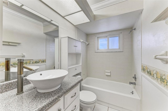 full bathroom with vanity, tiled shower / bath combo, toilet, and tile patterned floors