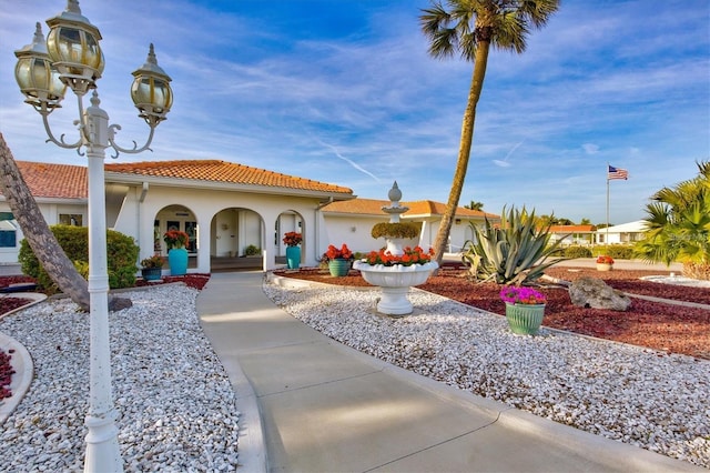 mediterranean / spanish-style home with a porch