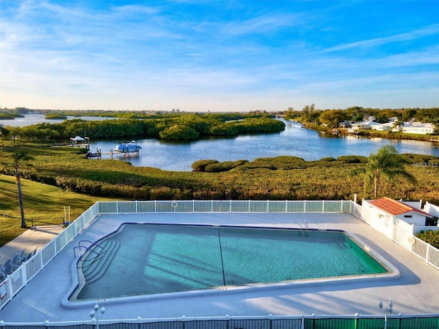 view of swimming pool with a water view