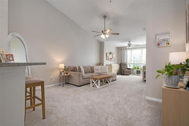 living room featuring light carpet, high vaulted ceiling, and ceiling fan