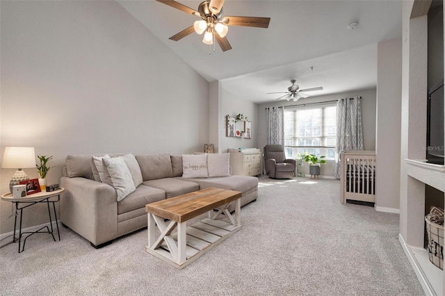 carpeted living room featuring lofted ceiling and ceiling fan