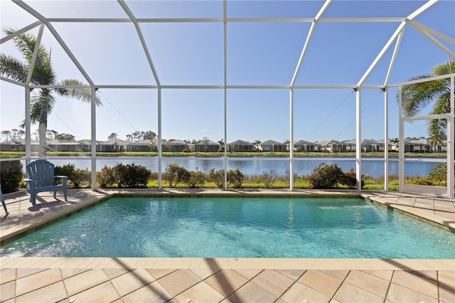 view of swimming pool featuring a lanai, a water view, and a patio