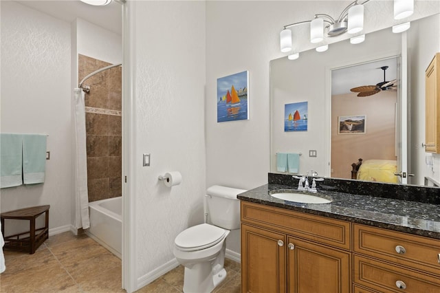 full bathroom featuring tile patterned floors, vanity, shower / tub combo, toilet, and ceiling fan