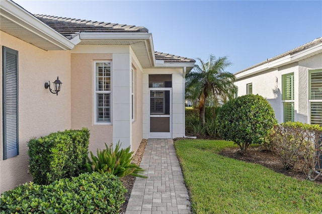 entrance to property with a yard