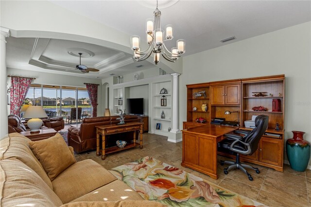 living room featuring a ceiling fan, a tray ceiling, decorative columns, and arched walkways