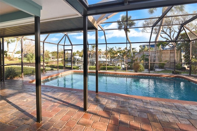 view of pool with a patio and a lanai