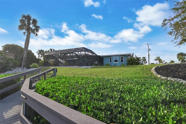 view of yard featuring glass enclosure