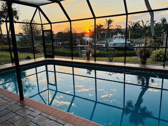 view of pool at dusk