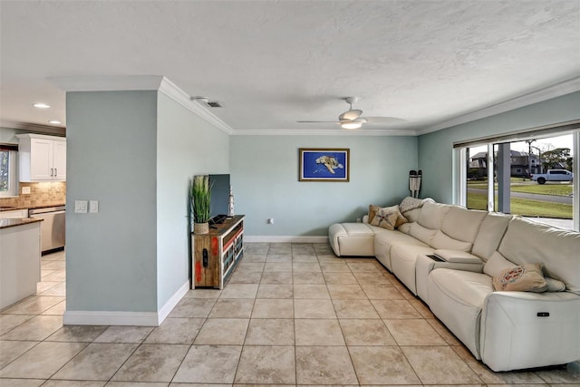 tiled living room featuring ceiling fan, crown molding, a textured ceiling, and sink