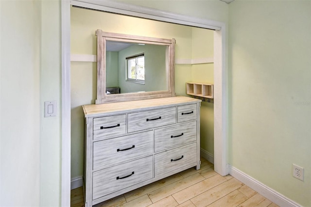 bathroom with hardwood / wood-style flooring and vanity