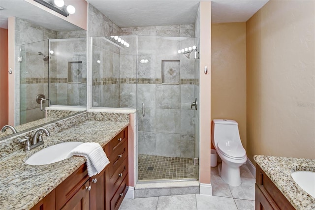 bathroom featuring tile patterned floors, a textured ceiling, vanity, toilet, and a shower with shower door