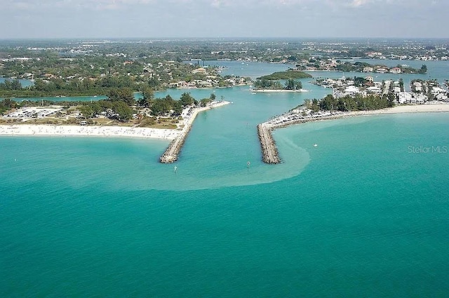 bird's eye view featuring a water view and a view of the beach