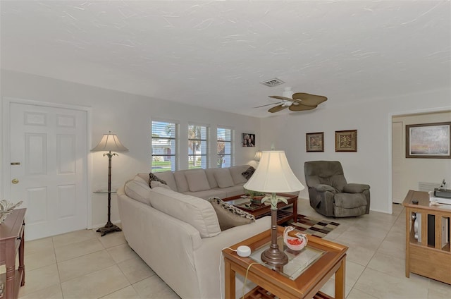 living room with light tile patterned floors and ceiling fan