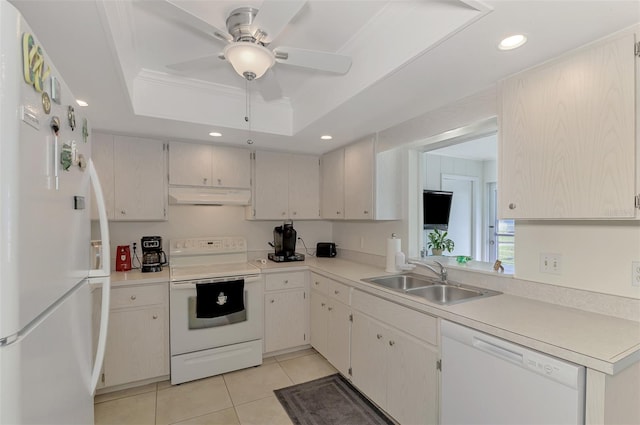 kitchen featuring ceiling fan, a raised ceiling, light tile patterned flooring, sink, and white appliances