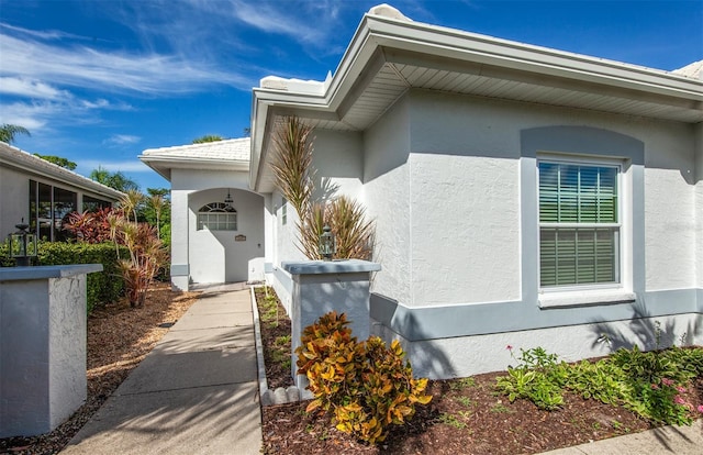 649 Crossfield Cir Unit 10, Venice, FL 34293 - doorway to property with stucco siding
