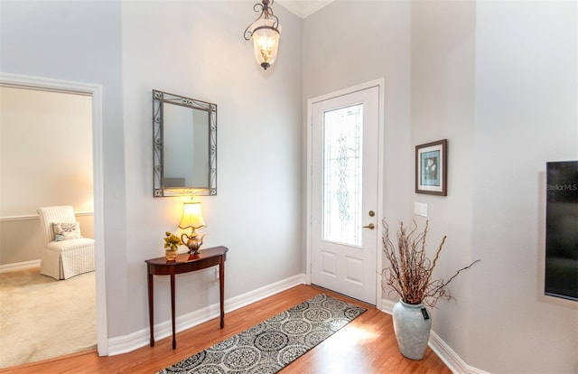 649 Crossfield Cir Unit 10, Venice, FL 34293 - entryway featuring wood finished floors, baseboards, and a high ceiling