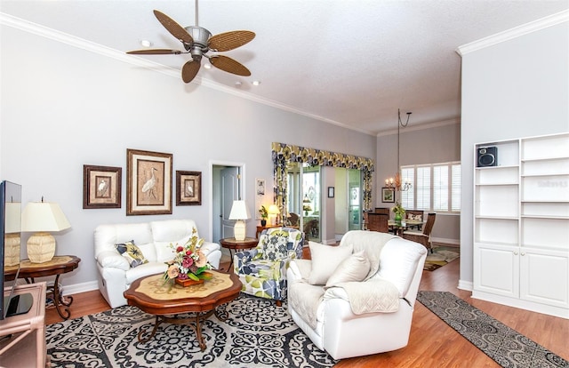 649 Crossfield Cir Unit 10, Venice, FL 34293 - living room featuring wood finished floors, baseboards, a ceiling fan, and crown molding