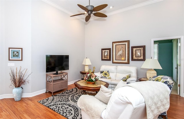 649 Crossfield Cir Unit 10, Venice, FL 34293 - living area featuring ceiling fan, ornamental molding, wood finished floors, and baseboards