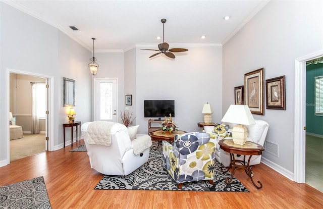 649 Crossfield Cir Unit 10, Venice, FL 34293 - living room featuring wood finished floors, a ceiling fan, baseboards, crown molding, and recessed lighting
