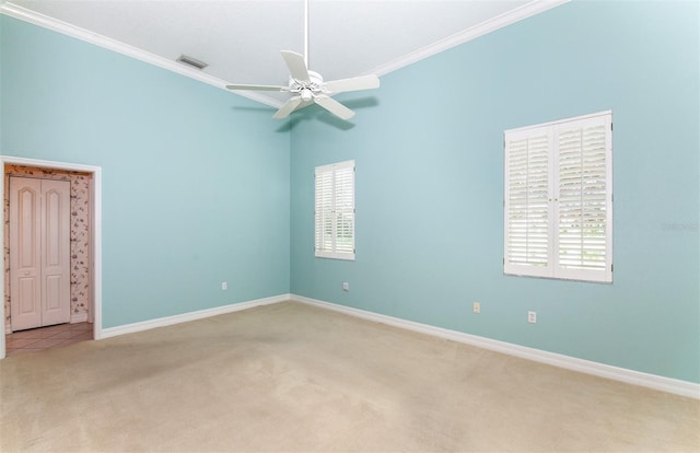 649 Crossfield Cir Unit 10, Venice, FL 34293 - carpeted empty room featuring crown molding, plenty of natural light, baseboards, and a ceiling fan
