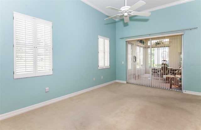 649 Crossfield Cir Unit 10, Venice, FL 34293 - carpeted empty room with crown molding, baseboards, a ceiling fan, and a high ceiling