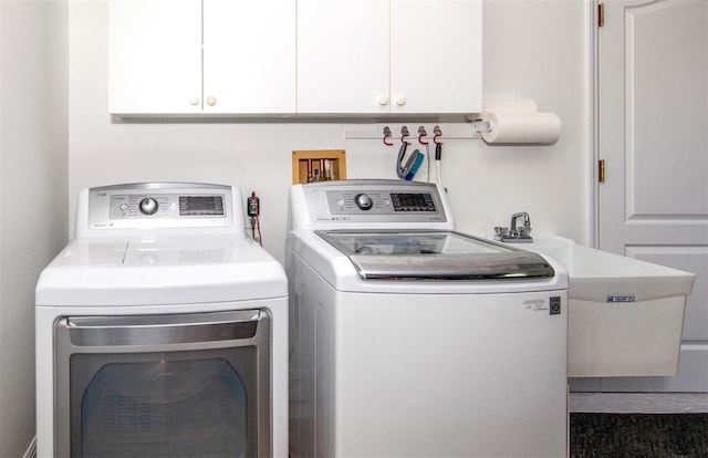649 Crossfield Cir Unit 10, Venice, FL 34293 - clothes washing area featuring independent washer and dryer and cabinet space