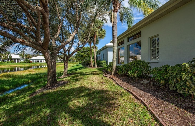 649 Crossfield Cir Unit 10, Venice, FL 34293 - view of green lawn featuring a water view